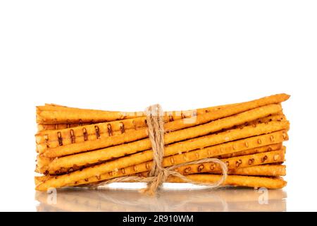 Straw is a bakery product. Several straws tied with jute thread isolated on a white background Stock Photo