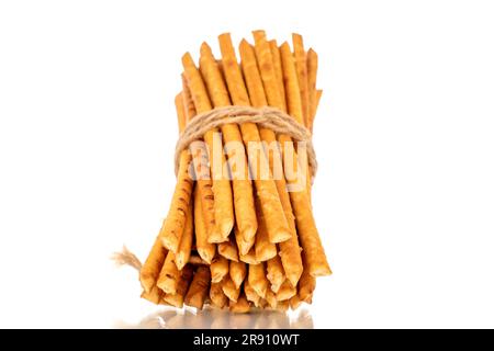 Straw is a bakery product. Several straws tied with jute thread isolated on a white background Stock Photo