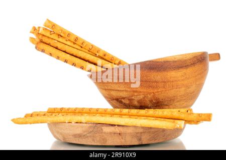 Straw is a bakery product. Several straws with wooden cup and saucer isolated on white background Stock Photo