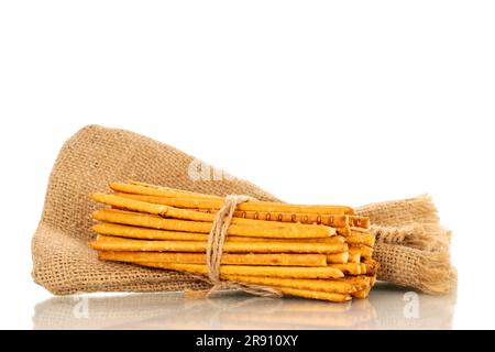 Straw is a bakery product. Several straws with a jute bag isolated on a white background Stock Photo