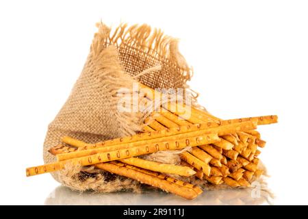 Straw is a bakery product. Several straws with a jute bag isolated on a white background Stock Photo