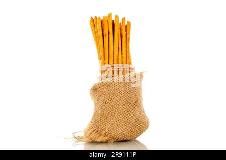 Straw is a bakery product. Several straws with a jute bag isolated on a white background Stock Photo