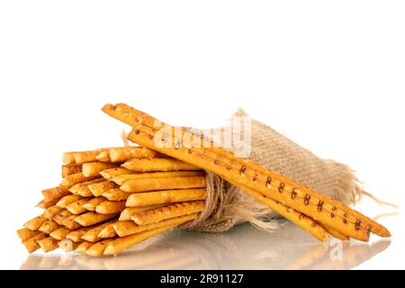 Straw is a bakery product. Several straws with a jute bag isolated on a white background Stock Photo
