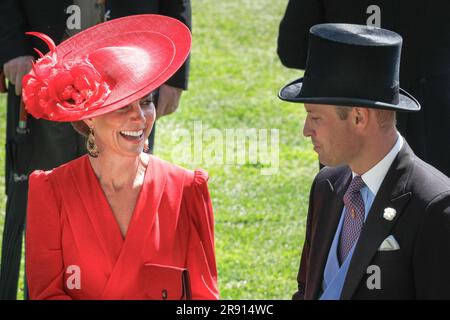 Ascot, Berkshire, UK. 23rd June, 2023. William, the Prince of Wales and Catherinechat and laugh. Catherine is wearing a red Alexander McQueen dress. The Royal Procession with the Royal family and their guests in carriages makes its way through the parade ring at Royal Ascot on Day Four of the horse racing event. Members of the Royal family then mingle on the lawn before moving to the Royal enclosure. Credit: Imageplotter/Alamy Live News Stock Photo