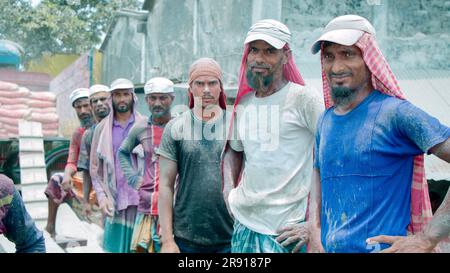 Daily wage workers stand in line and takeing rest after their work. Labour where people come for work . They usually come in morning at this hub and w Stock Photo