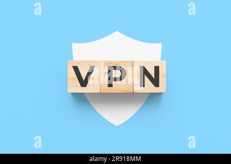 VPN (Virtual Private Network) wooden cubes on blue background with white shield icon Stock Photo
