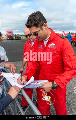 David Montenegro and other Red Arrows pilots signing autographs for fans at Farnborough airshow. Royal Air Force display pilots meeting fans Stock Photo