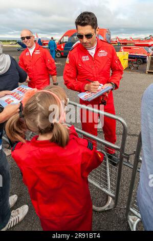 David Montenegro and other Red Arrows pilots signing autographs for fans at Farnborough airshow. Royal Air Force display pilots meeting fans Stock Photo