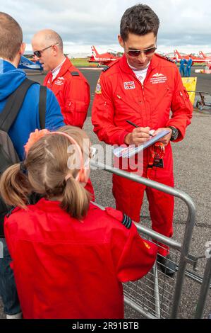 David Montenegro and other Red Arrows pilots signing autographs for fans at Farnborough airshow. Royal Air Force display pilots meeting fans Stock Photo