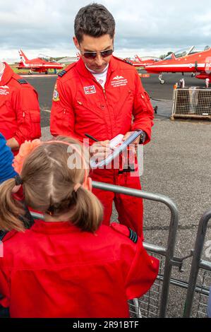 David Montenegro and other Red Arrows pilots signing autographs for fans at Farnborough airshow. Royal Air Force display pilots meeting fans Stock Photo