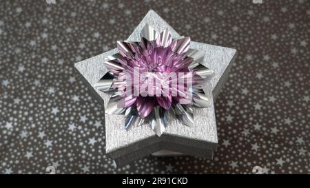 Silver shiny paper box a star shaped with silver-purple bow. Star gift box ideal for Christmas Stock Photo