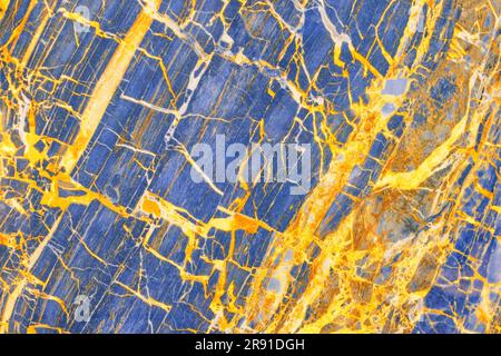 Luxurious blue marble with gold veins, structured polished mineral slice. Stock Photo