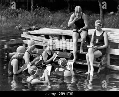 Camp Kitteredge, New York:  July 14, 1926. These stenographers on vacation are taking no chance of going stale. Here they are taking daily classes to keep in practice. Stock Photo