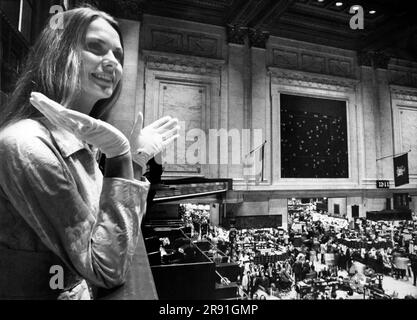 New York, New York:  June 11, 1972 Miss USA, Tanya Wilson, is fascinated when she visits the NY Stock Exchange. Stock Photo