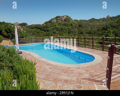Swimming pool in nature, Sardinia, Italy Stock Photo