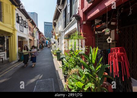 Local people on some of the smaller colourful streets of Singapore Stock Photo