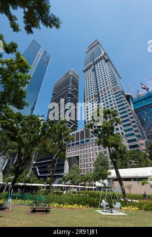 Skyscrapers and a park in downtown Singapore Stock Photo