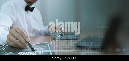Businessman analyzing financial investment strategy with economic growth.  data analytic technology and banking network service develop profit stabili Stock Photo