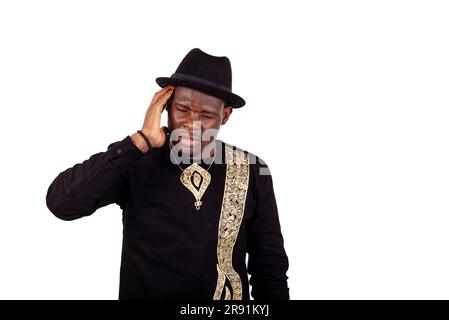well dressed sick young man suffering from a headache. Stock Photo