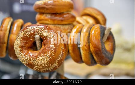 Freshly baked bagels with sesame seeds and poppy seeds closeup Stock Photo