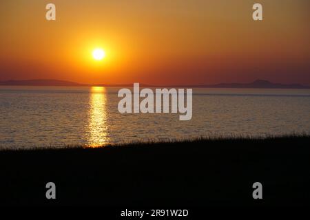Sunset over the  Llŷn Peninsula from near Tonfanau, Tywyn, Gwynedd Stock Photo