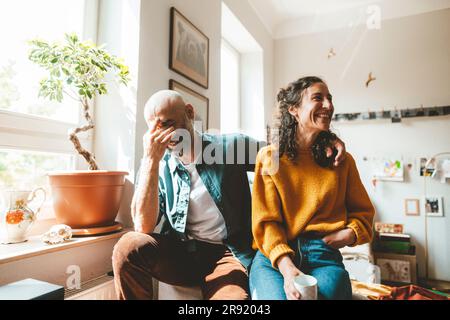 Happy mature couple spending leisure time at home Stock Photo
