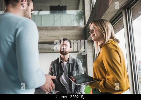 Business colleagues conducting meeting at workplace Stock Photo