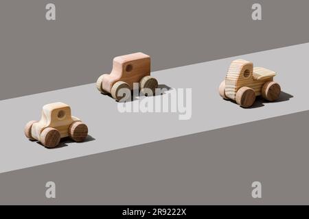 Wooden cars on gray background Stock Photo