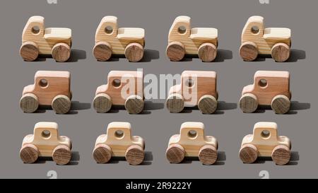 Wooden toy cars on gray background Stock Photo