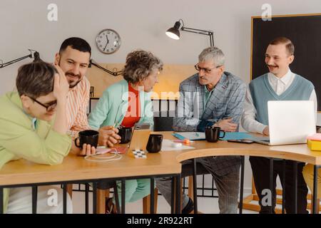 Group of business people talking in the studio, recording video lesson Stock Photo
