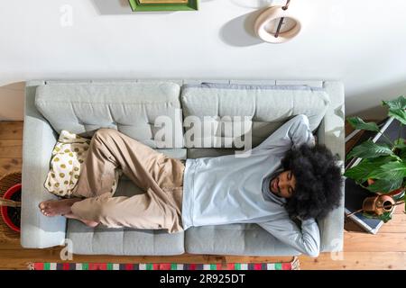 Young man sleeping on sofa at home Stock Photo
