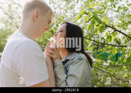 Smiling romantic couple looking at each other in park Stock Photo