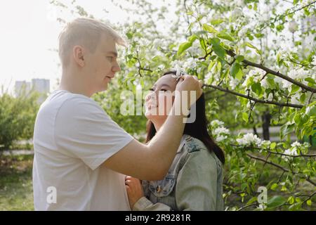Romantic couple standing face to face at park Stock Photo