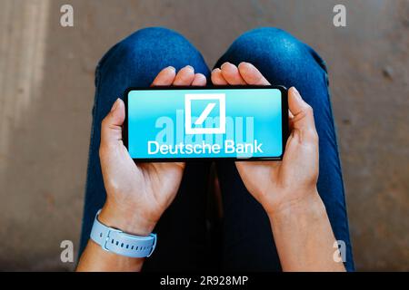 In this photo illustration, the Deutsche Bank AG logo is displayed on a smartphone mobile screen. Stock Photo