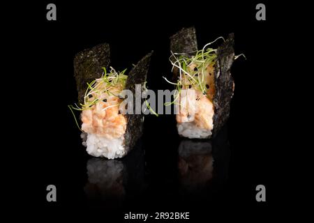 Gunkan maki sushi with tiger prawn on black background Stock Photo