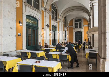 Lisbon, Portugal - March 8, 2023: Martinho Da Arcada, the oldest restaurant in Lisbon. Customers being served meals Stock Photo