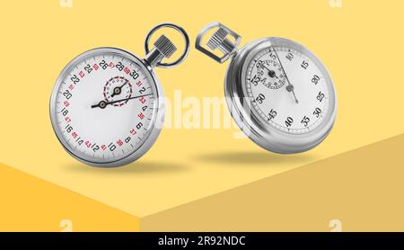 Concept of time. Vintage timers in air on yellow background Stock Photo