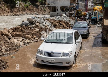 Aftermath of the heavy flood in river swat at Bahrain valley that damaged the hotels and wash out the asphalt road: Bahrain swat, Pakistan - June 12, Stock Photo