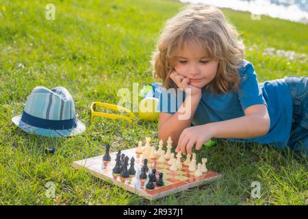 Concentrated serious boy developing chess gambit, strategy ,playing board  game to winner clever concentration and thinking child while playing chess.  Learning, tactics and analysis concept. 7292819 Stock Photo at Vecteezy
