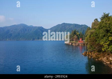 Lake Tazawa and Torii Gate of Ozaishi Shrine Stock Photo