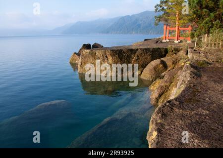 Lake Tazawa and Torii Gate of Ozaishi Shrine Stock Photo