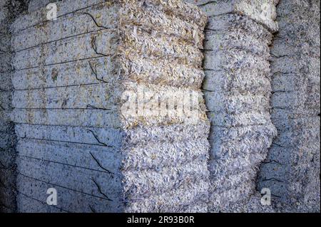 Stacked packages of shredded waste paper for recycling in Switzerland. Environment conservation. Stock Photo