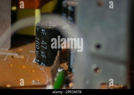 Old Macro-photo of carbon resistors on old circuit board / PCB Stock Photo