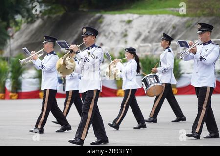 The marching band of Hong Kong Police Force march during the parade. A police passing out parade is held at the Hong Kong Police College. More than one hundred police officers have graduated from the Police College this month. The parade symbolize they have finished their studying at the police college and become a formal police officer from now on. The Deputy Commissioner of Police (Operations), Mr Yuen Yuk-kin, was the reviewing officer at the passing-out parade of probationary inspectors and recruit police constables. Stock Photo