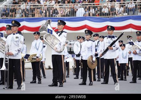 The marching band of Hong Kong Police Force march during the parade. A police passing out parade is held at the Hong Kong Police College. More than one hundred police officers have graduated from the Police College this month. The parade symbolize they have finished their studying at the police college and become a formal police officer from now on. The Deputy Commissioner of Police (Operations), Mr Yuen Yuk-kin, was the reviewing officer at the passing-out parade of probationary inspectors and recruit police constables. Stock Photo