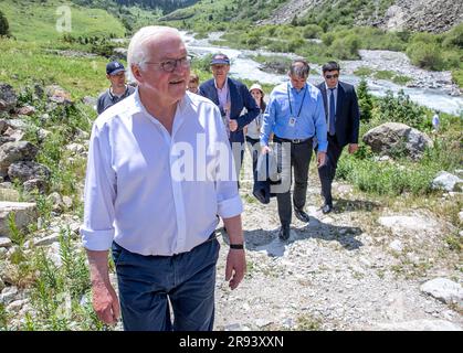 23 June 2023, Kyrgyzstan, Bischkek: German President Frank-Walter Steinmeier is hiking through Kyrgyzstan's Ala Artscha National Park with the Golubin Glacier and learning about the geological consequences of climate change in Kyrgyzstan. In addition to political talks, the two-day state visit to Kyrgyzstan will also include meetings with students, a visit to a glass factory and a tour of the Ala Artscha National Park. Photo: Jens Büttner/dpa Stock Photo