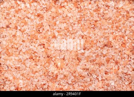 Himalayan salt, coarse crystals, from above. Rock salt, halite, with a pinkish tint, due to trace minerals, mined from the Punjab region. Stock Photo