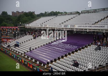 Chester le Street, 23 June 2023. Spectators sheltering from the rain at the Vitality Blast match between Durham Cricket and Yorkshire Vikings at Seat Unique Riverside, Chester le Street. Credit: Colin Edwards Stock Photo