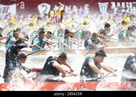 (230624) -- FUZHOU, June 24, 2023 (Xinhua) -- People compete in a dragon boat race in Fuzhou of southeast China's Fujian Province, on June 22, 2023. The Dragon Boat Festival, also known as Duanwu Festival, traditionally falls on the fifth day of the fifth month in the Chinese lunar calendar. The dragon boat competition, a traditional part of the festival, has gained popularity on both sides of the Taiwan Strait, bringing excitement to a wide range of people.  Located on the southeastern coast of China, Fujian Province is ideal for water sports with its widely scattered rivers, lakes and the se Stock Photo