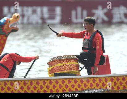 (230624) -- FUZHOU, June 24, 2023 (Xinhua) -- A student from Northeast Electric Power University competes in a dragon boat race in Fuzhou of southeast China's Fujian Province, on June 22, 2023. The Dragon Boat Festival, also known as Duanwu Festival, traditionally falls on the fifth day of the fifth month in the Chinese lunar calendar. The dragon boat competition, a traditional part of the festival, has gained popularity on both sides of the Taiwan Strait, bringing excitement to a wide range of people.  Located on the southeastern coast of China, Fujian Province is ideal for water sports with Stock Photo